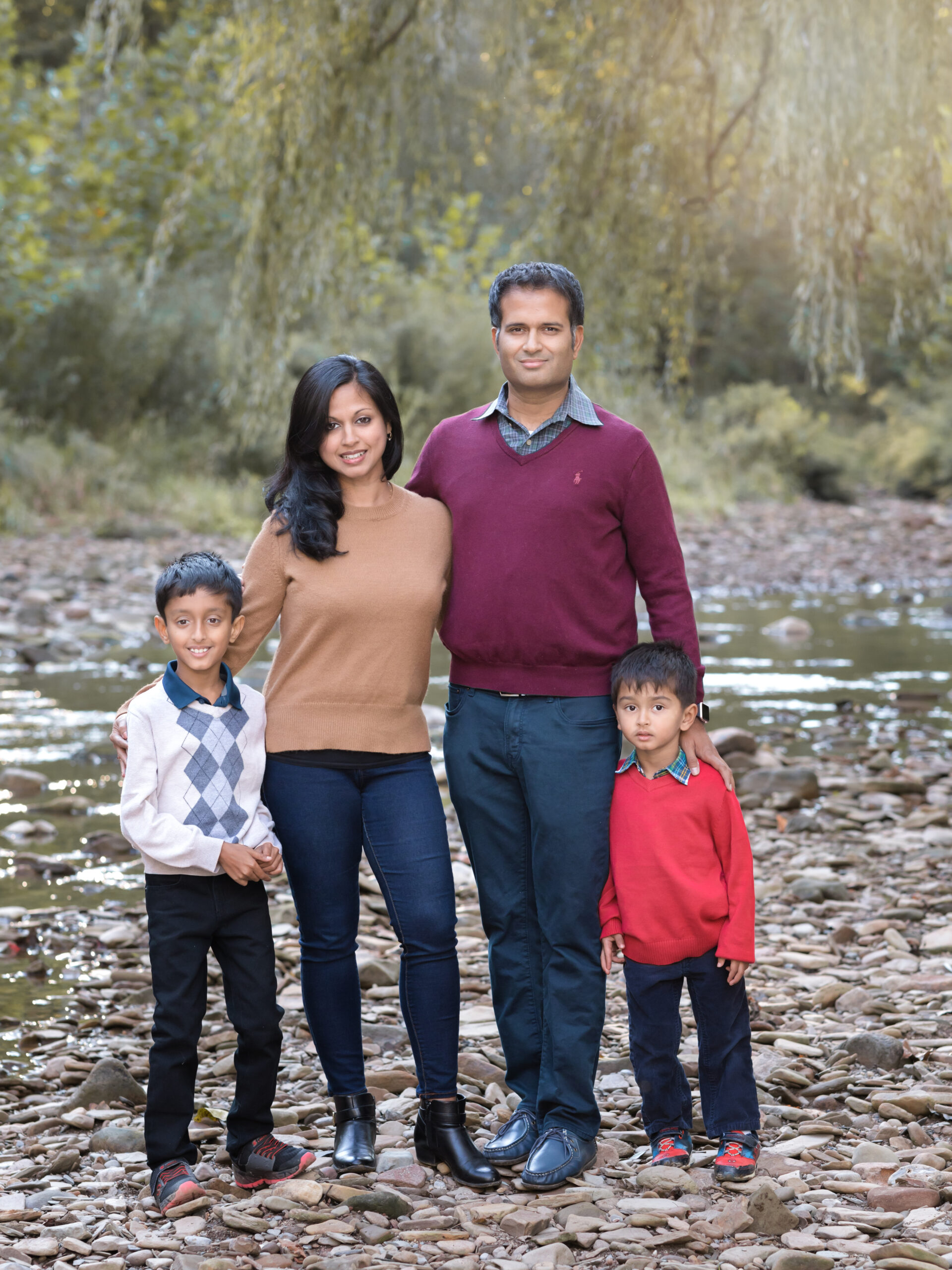 Mom, Dad and two sons by the creek
