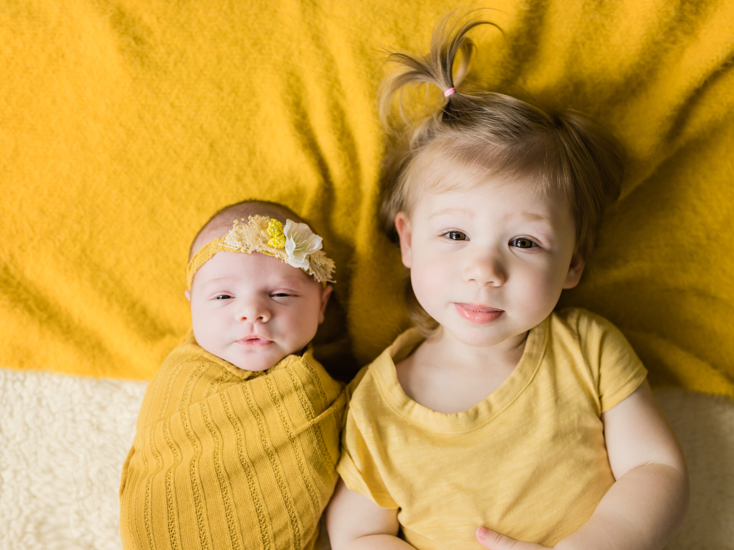 newborn baby girl and sister