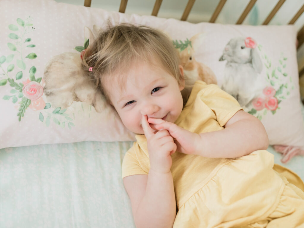 little girl in crib