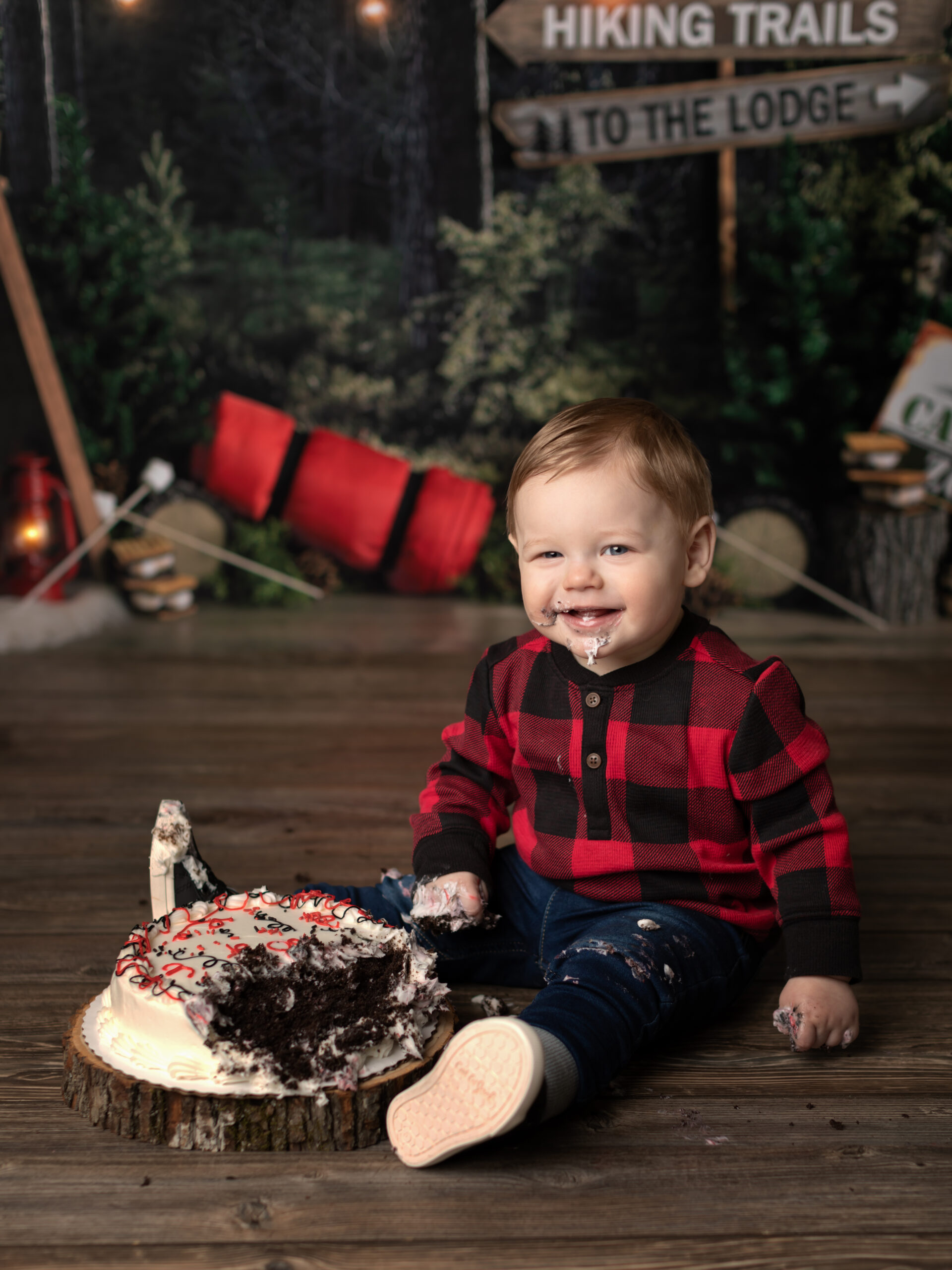 one year old photoshoot smashing cake