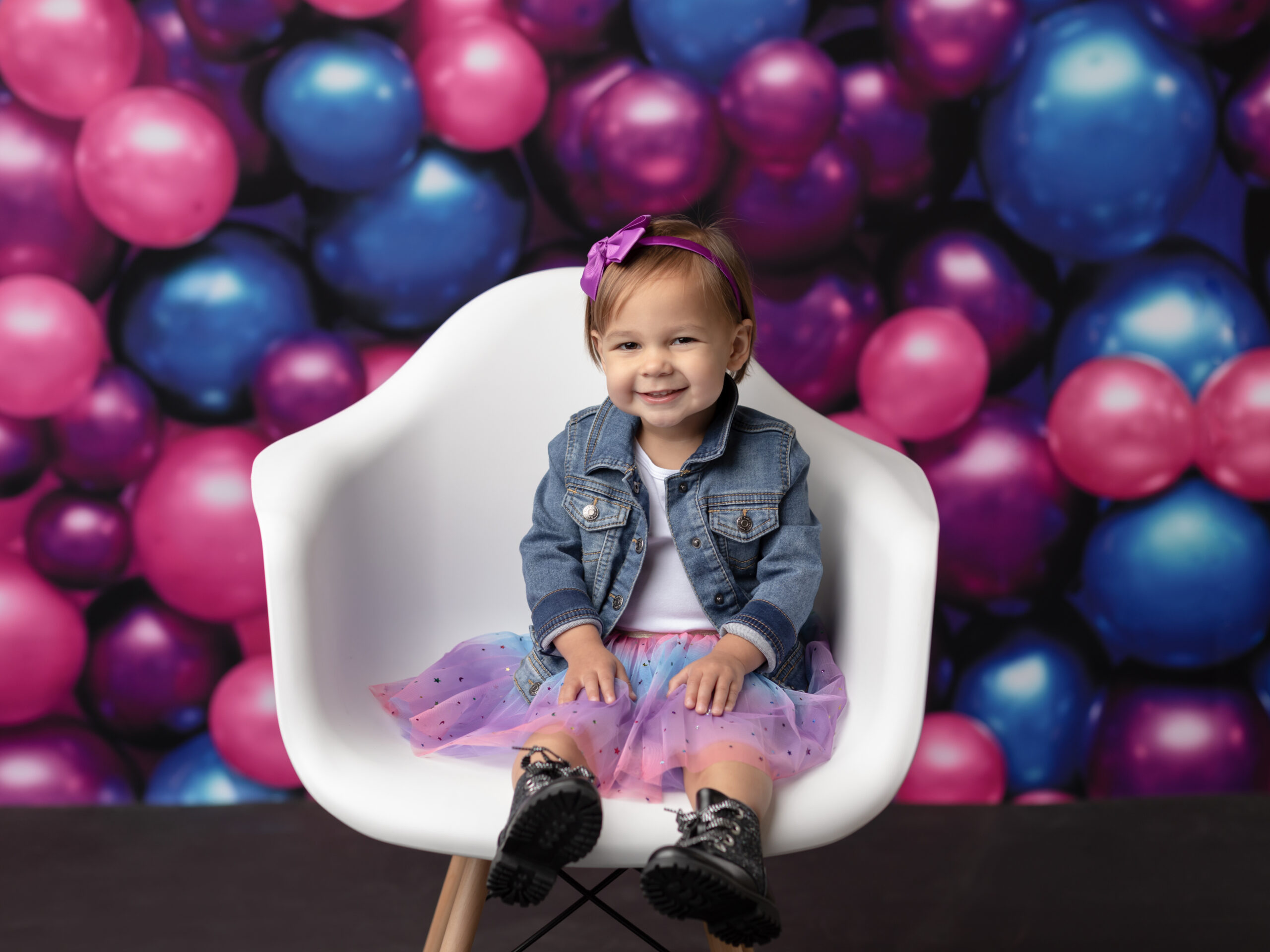 two year old girl sitting in chair