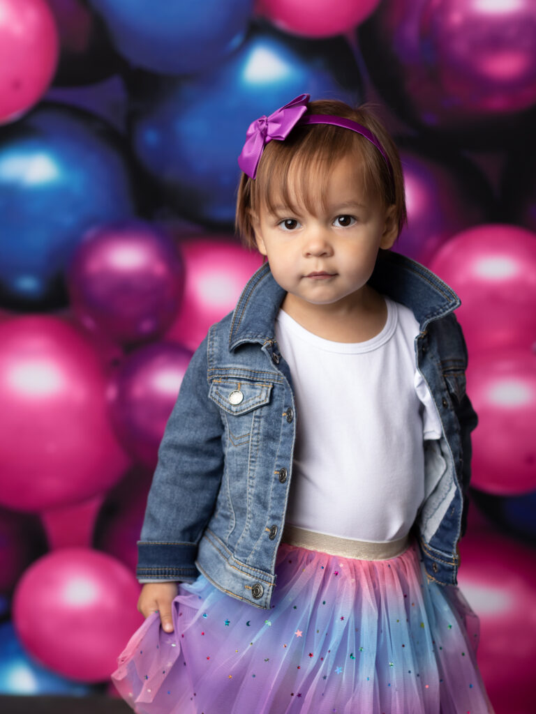 Two year old wearing a tutu for birthday photoshoot