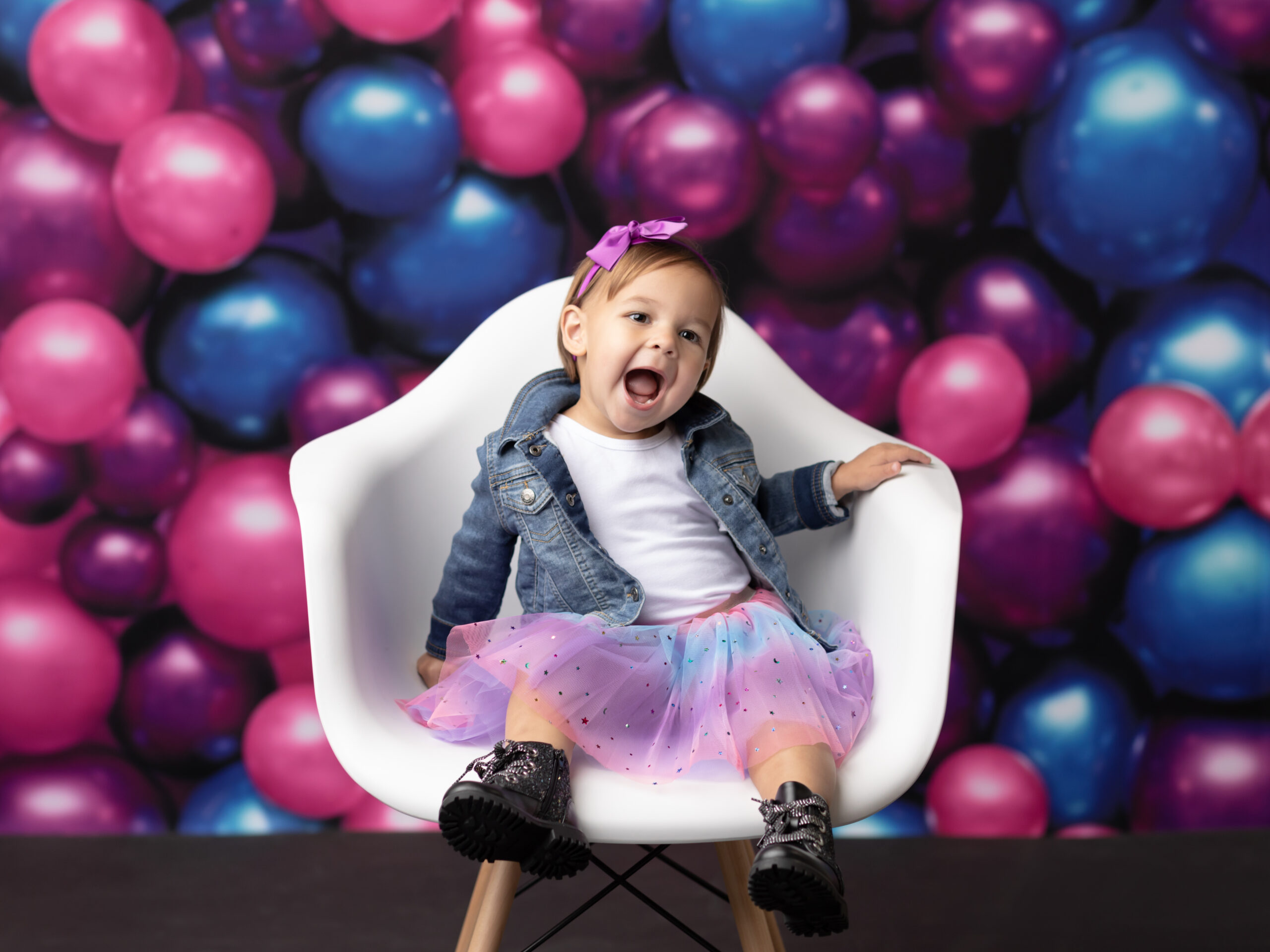 two year old girl sitting in chair