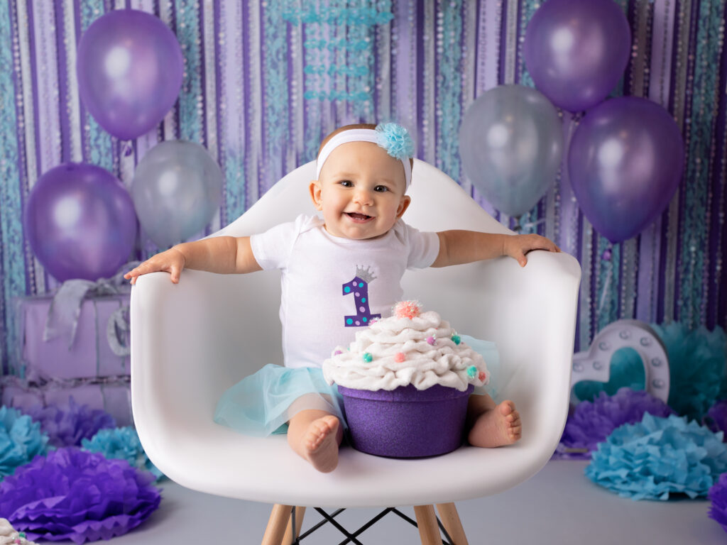 one year old birthday photo with purple balloons Build-a-Bear Strongsville Will Keep a Smile On Your Child’s Face!