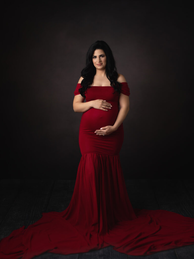pregnant mom in red maternity gown for maternity photos