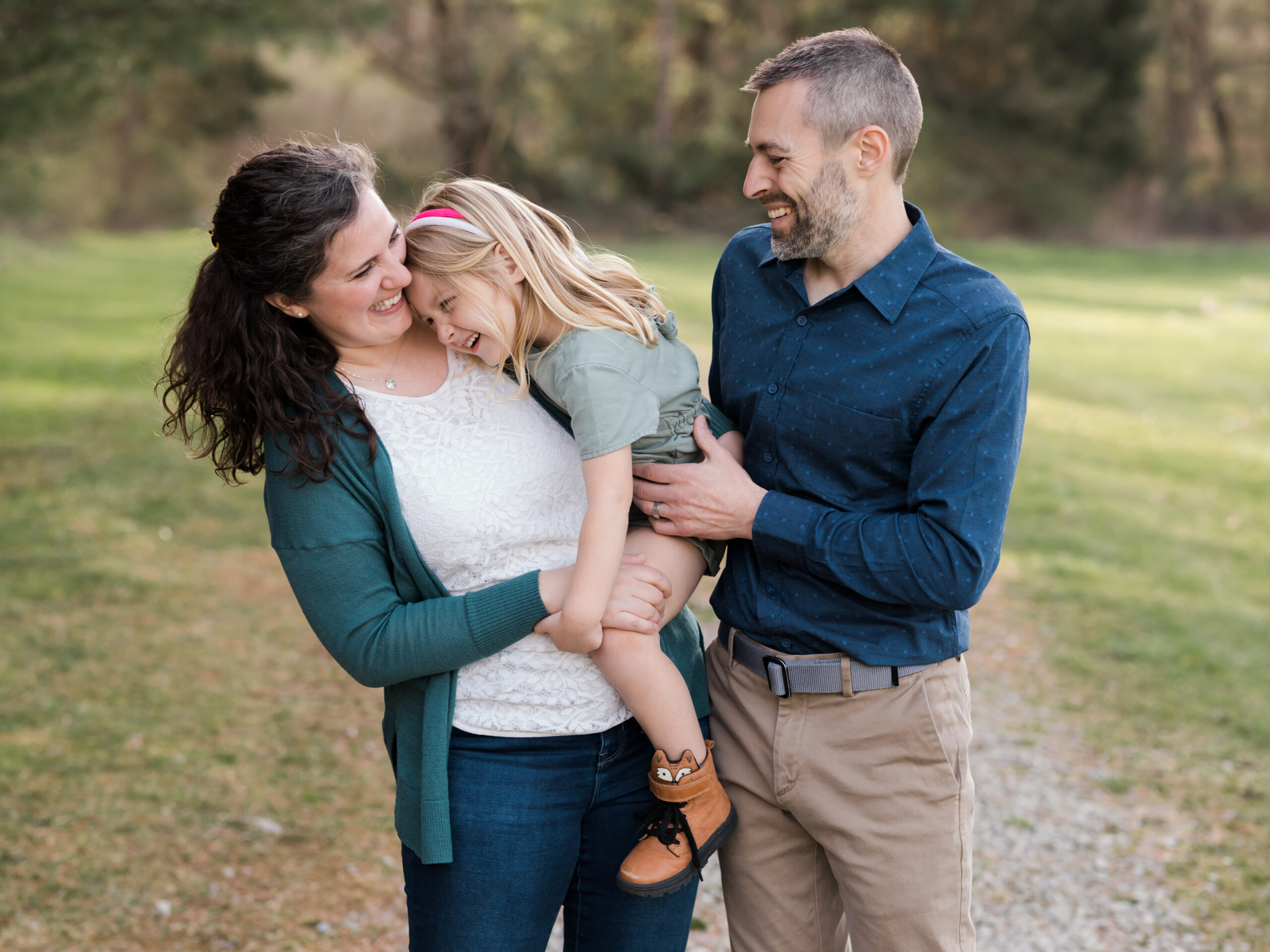 mom and dad tickling daughter for family photos Canon Mark IV