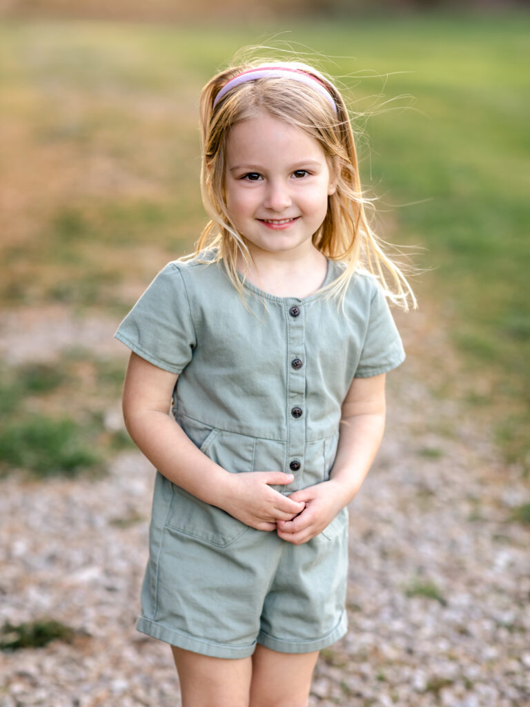 little girl posing for family portraits at park Canon EOS 5D Mark IV Review