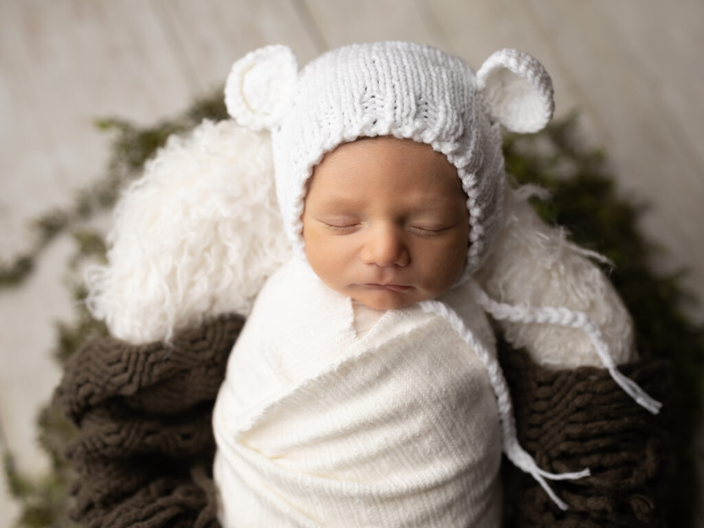 newborn baby wrapped in white The Spa at Yellow Creek