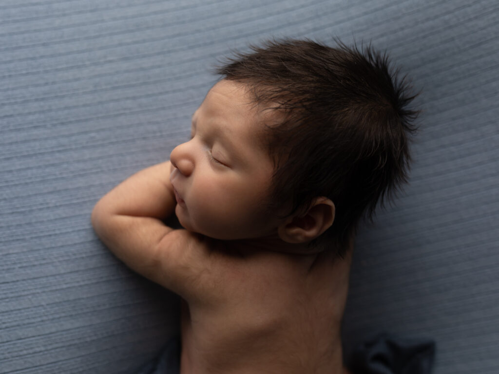 newborn baby wrapped in blue The Spa at Yellow Creek
