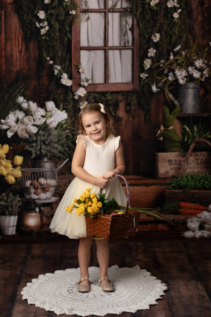 girl holding yellow flowers for studio portrait