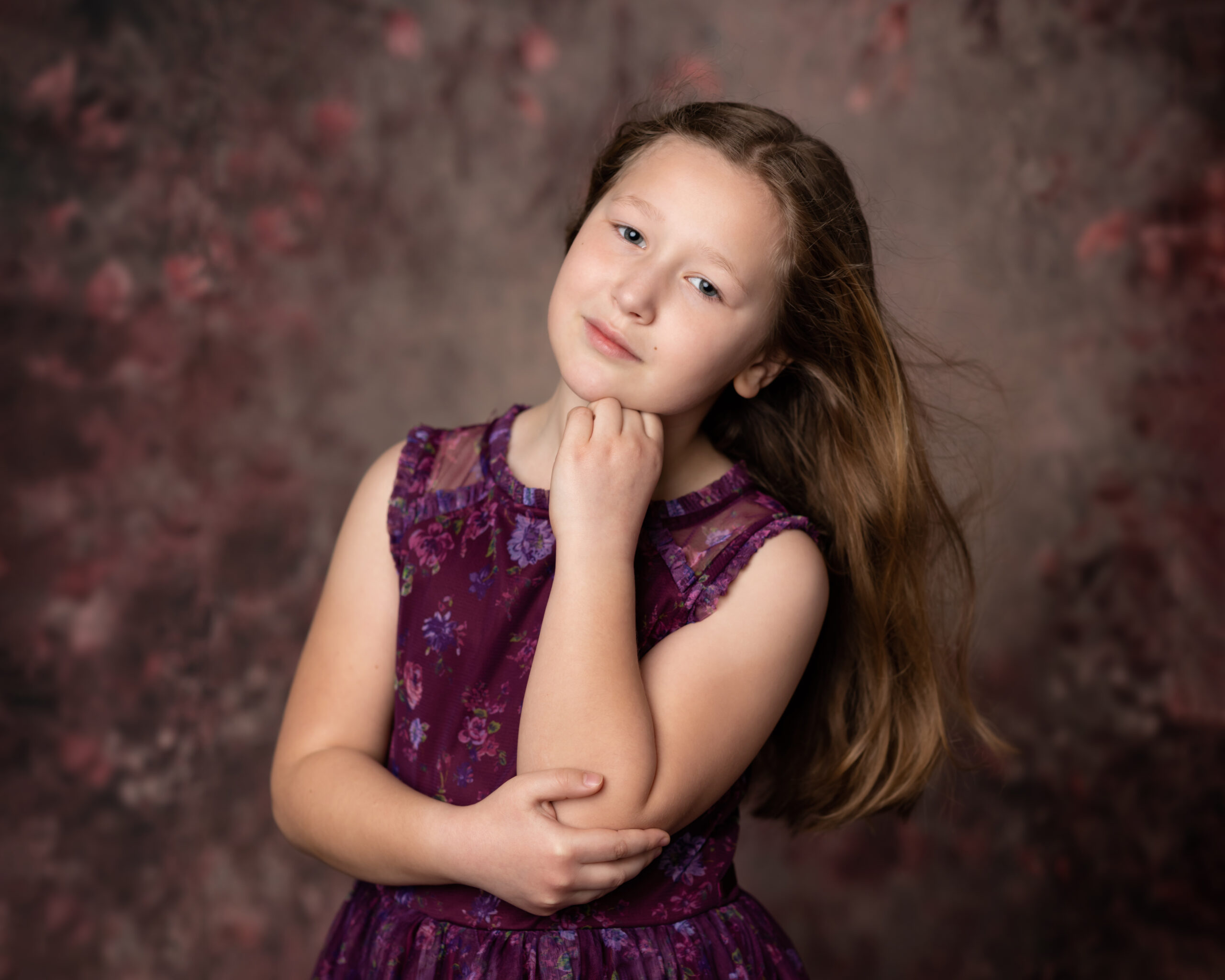 girl in purple flower dress for studio portraits