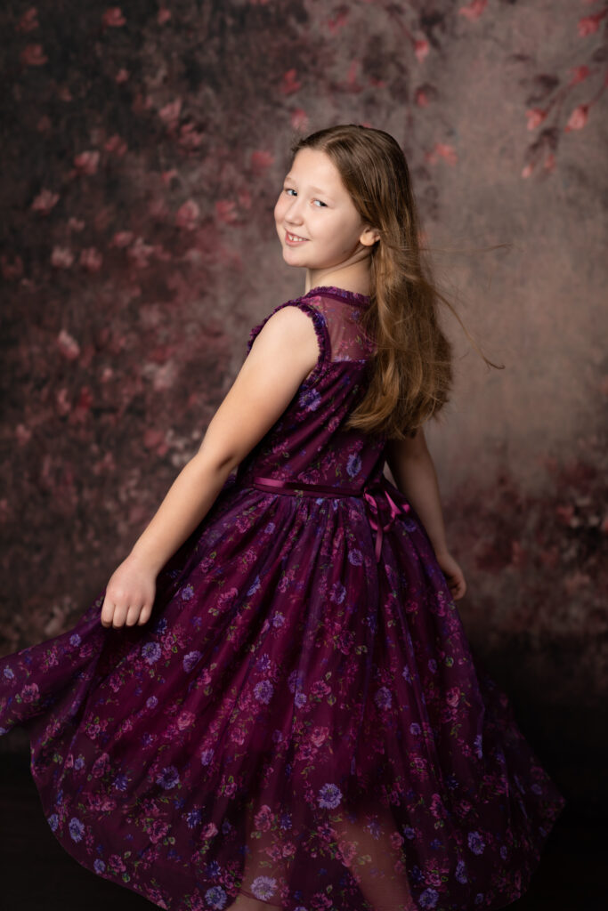 girl wearing purple dress for birthday photoshoot