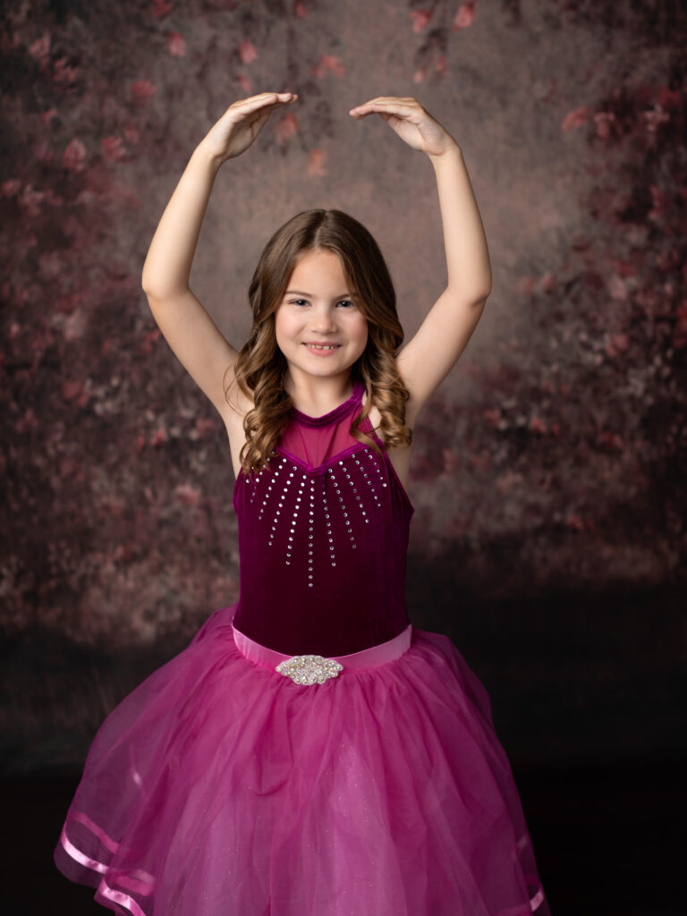 girl in pink dance costume posing for studio portraits, cleveland ohio