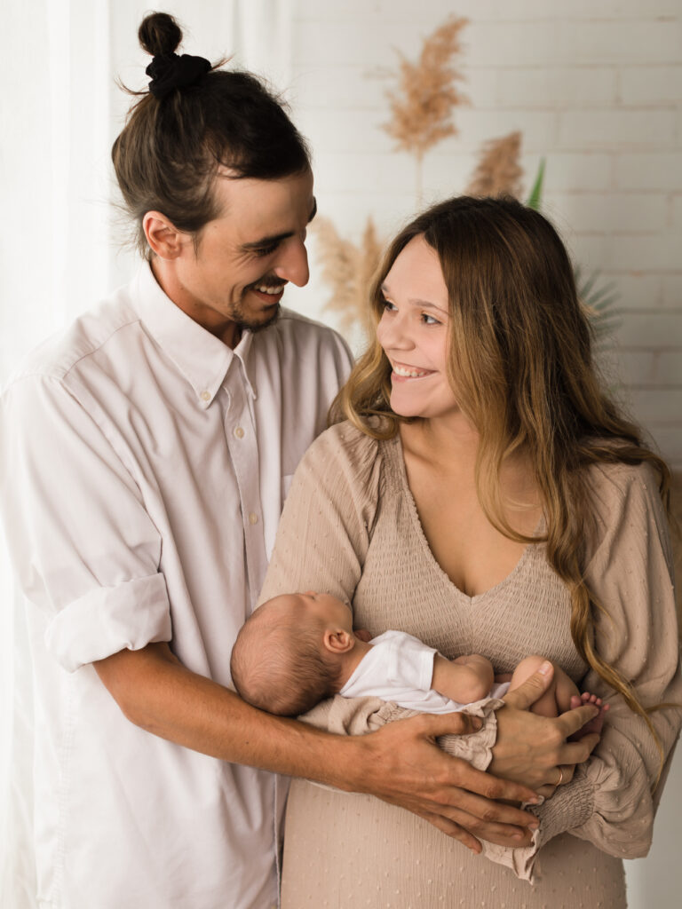 Parents holding their newborn baby boy Childbirth and Parenting Classes in Cleveland