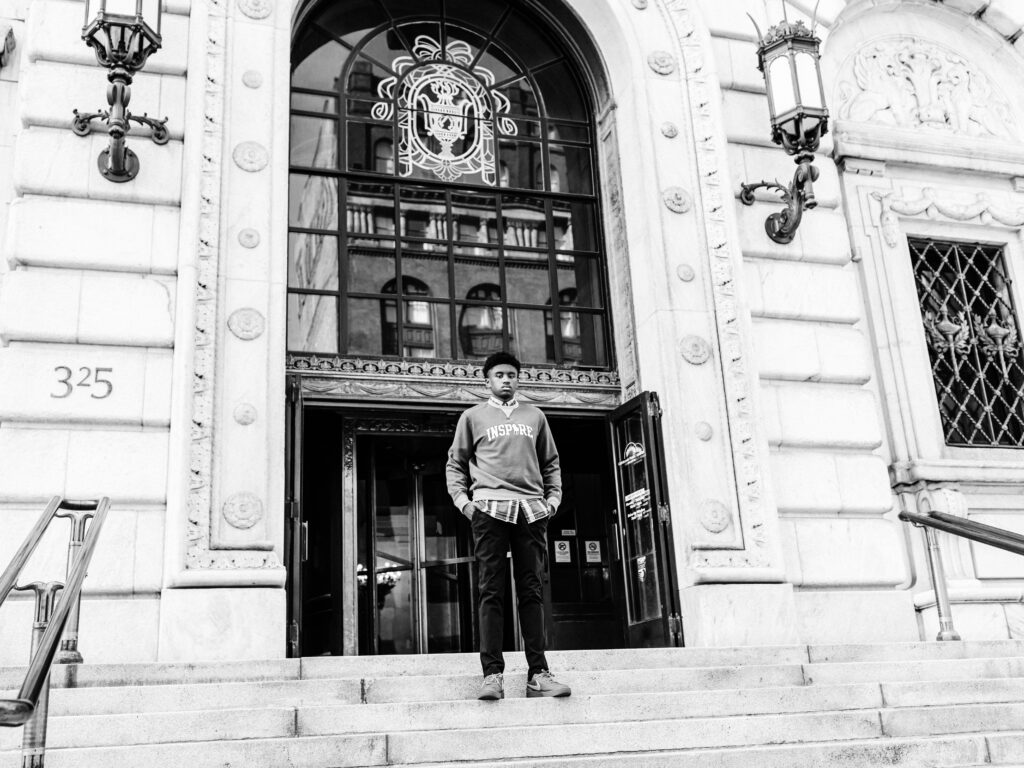 senior boy posing at cleveland public library