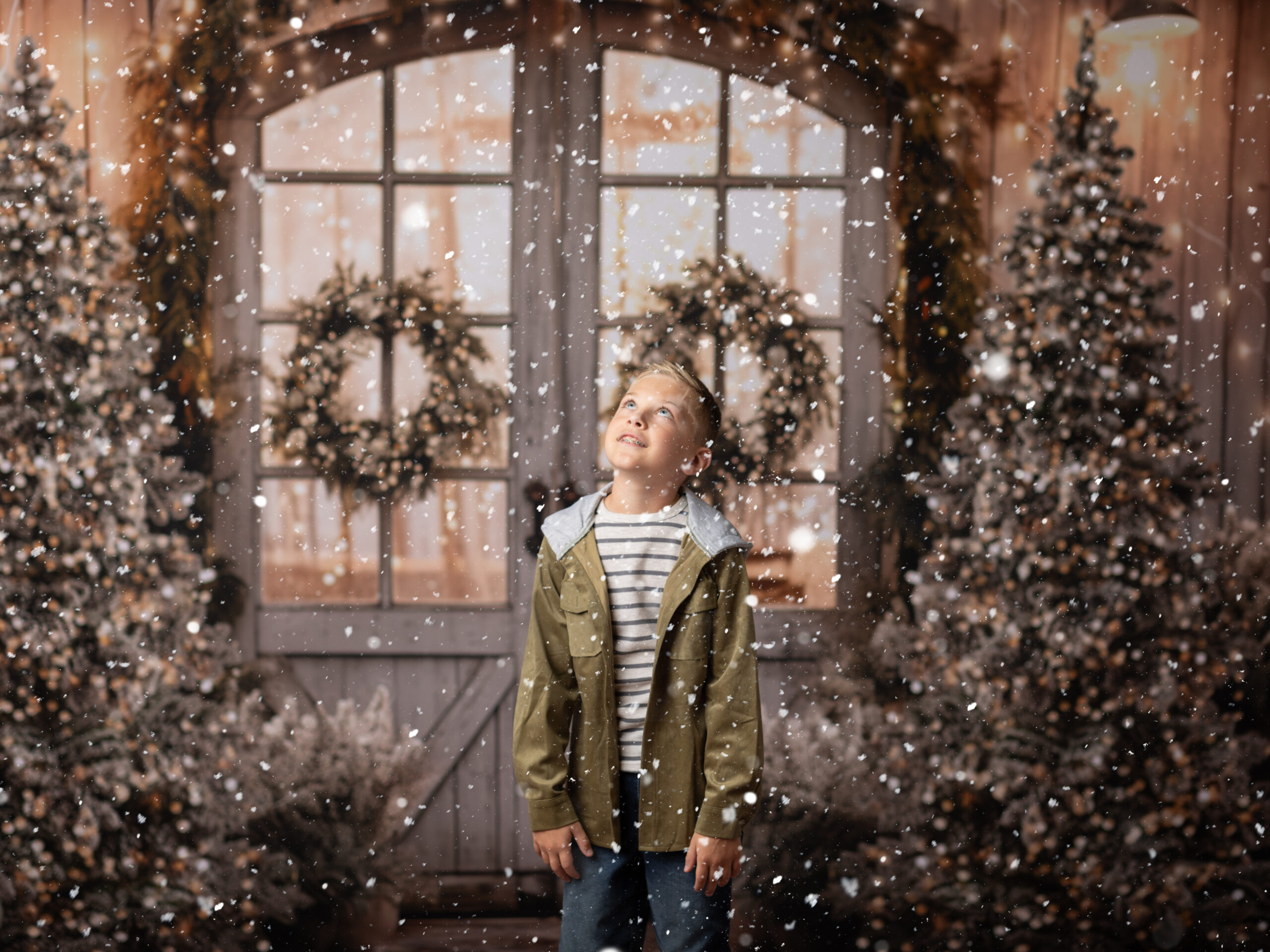 boy in green hoodie posing for Christmas Portraits Christmas photography sessions in Cleveland