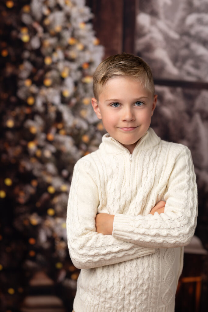 boy posing for christmas portraits