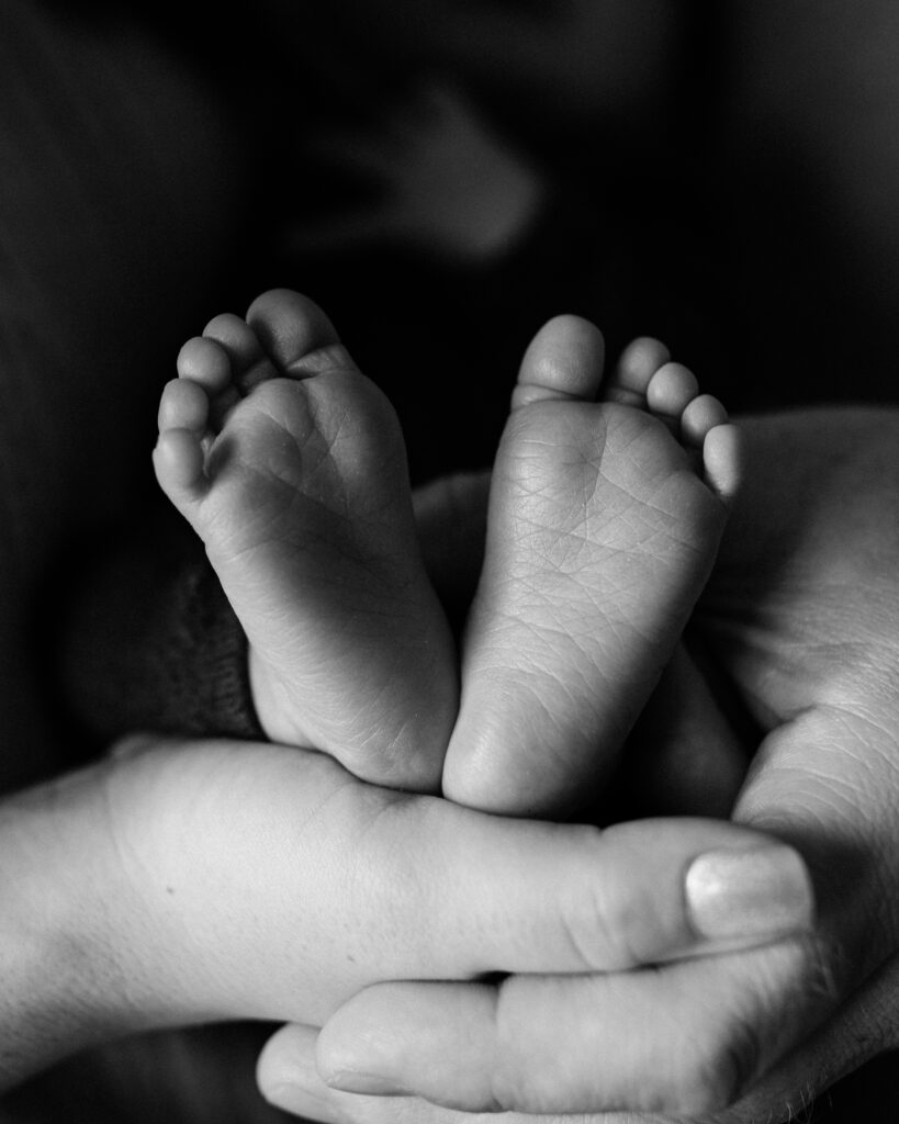 newborn baby boy feet in black and white  Southwest General Medical Group