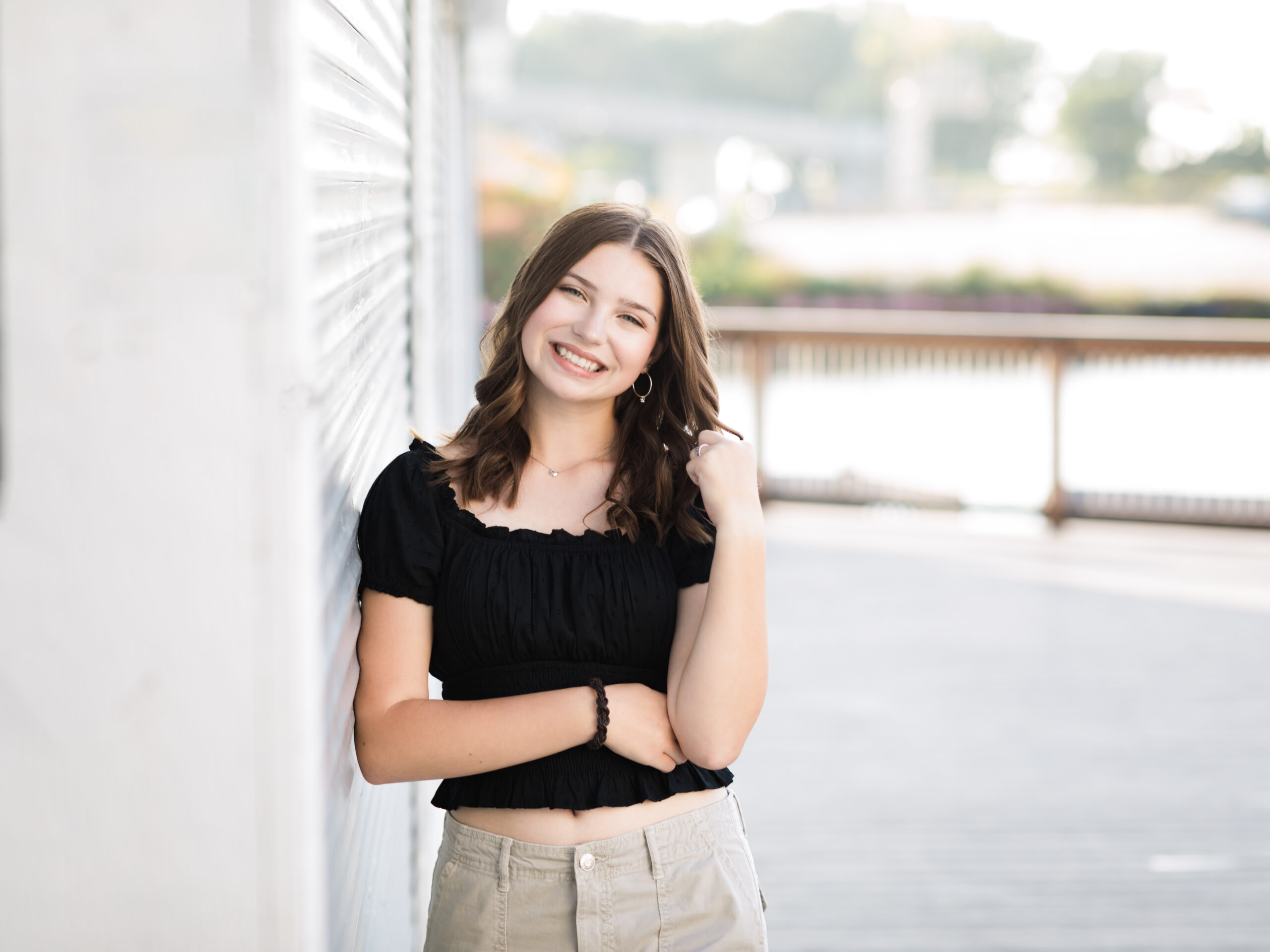 high school senior girl in black shirt posing for senior portraits Cleveland Private Schools