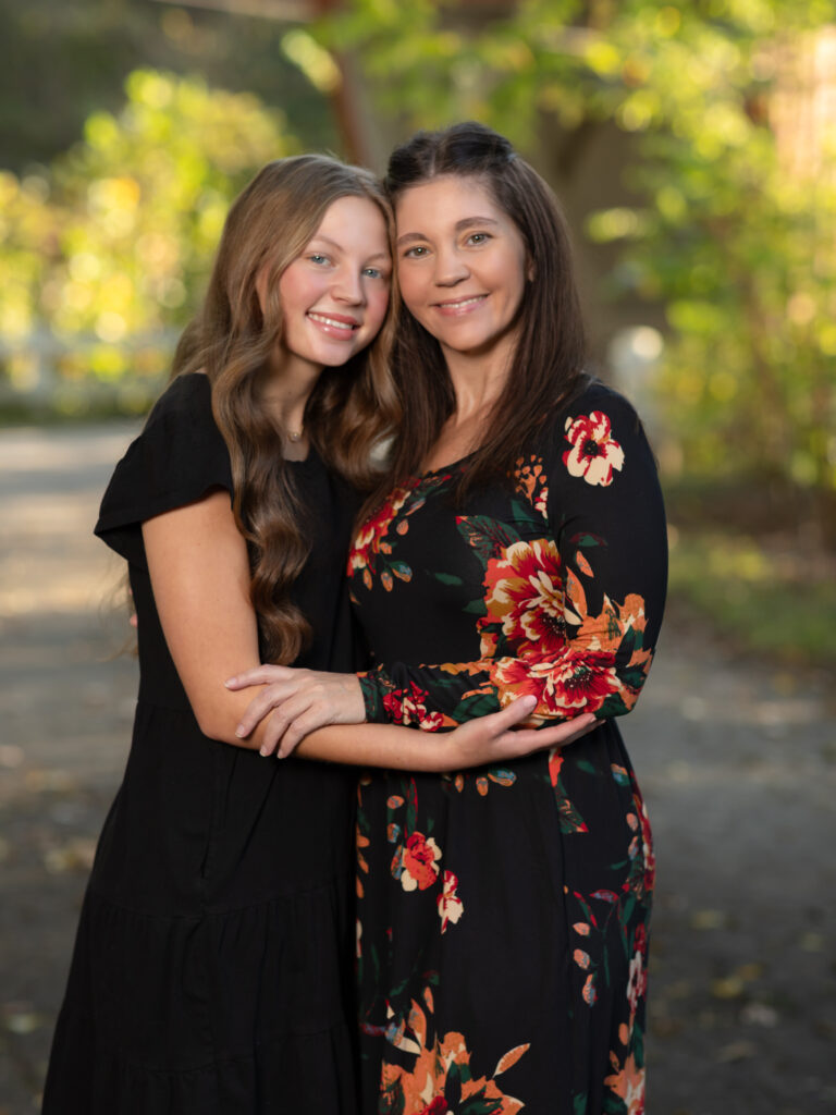 mother and daughter hugging for fall family photos