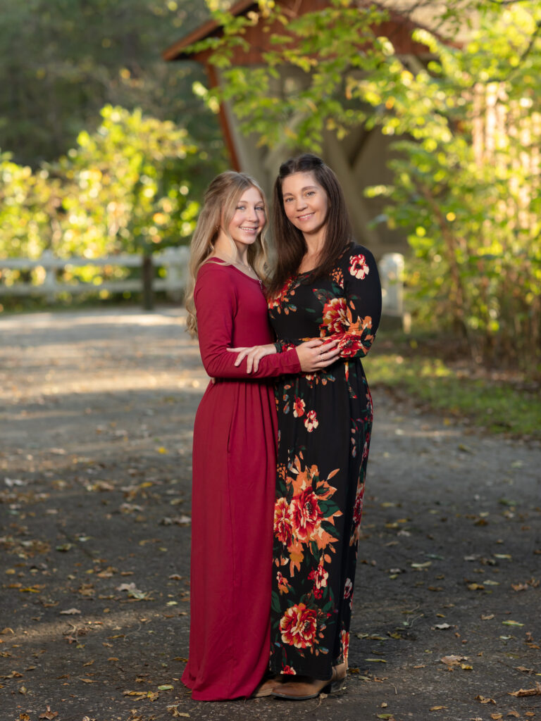 mother and daughter hugging for fall family photos