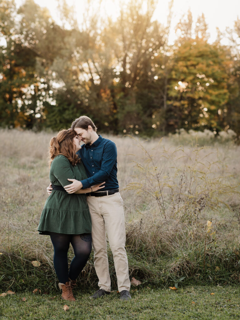 husband and wife hugging for fall family photos