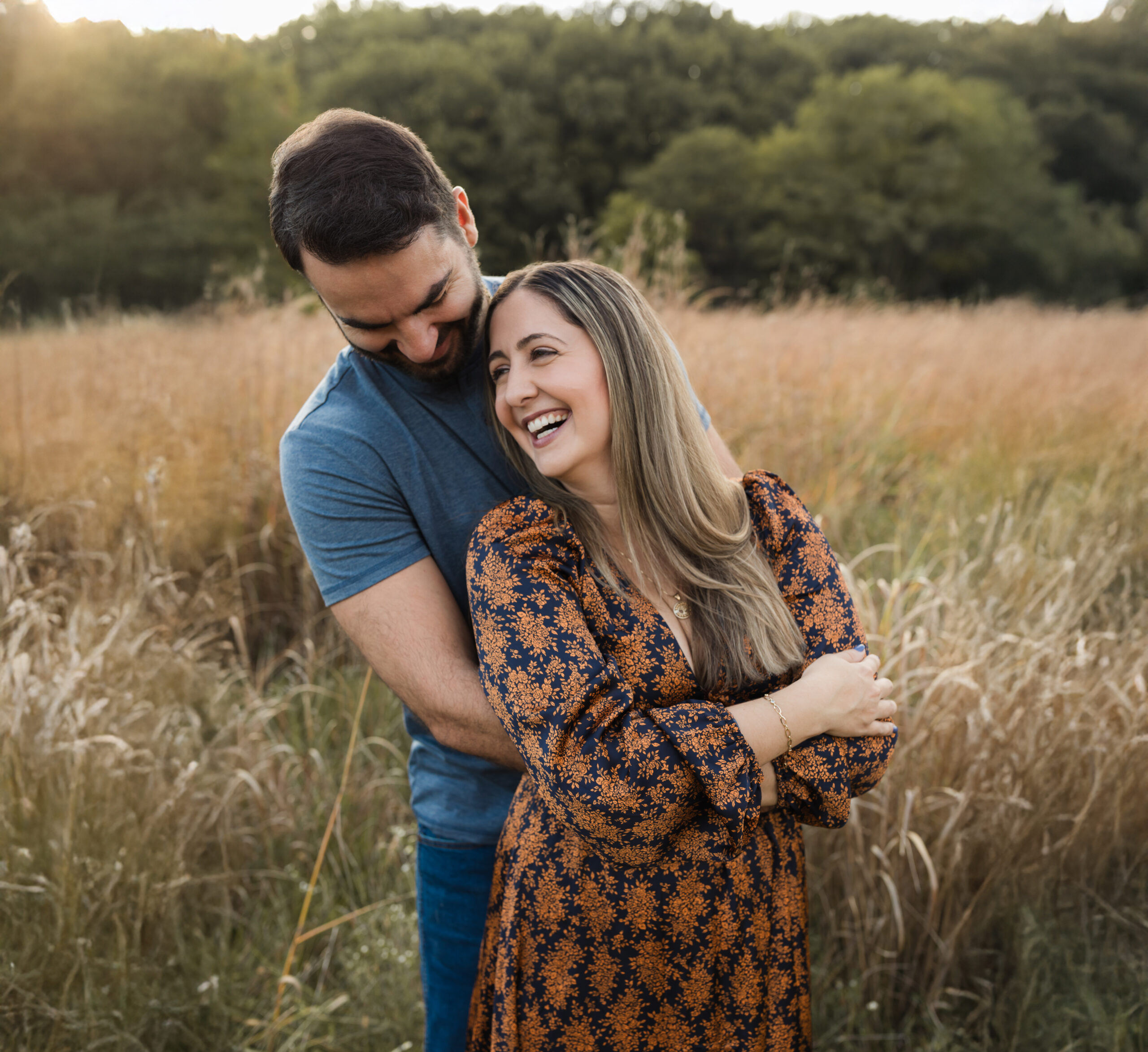 husband hugging wife while laughing for family photos Date Night Cooking Classes in Cleveland Ohio